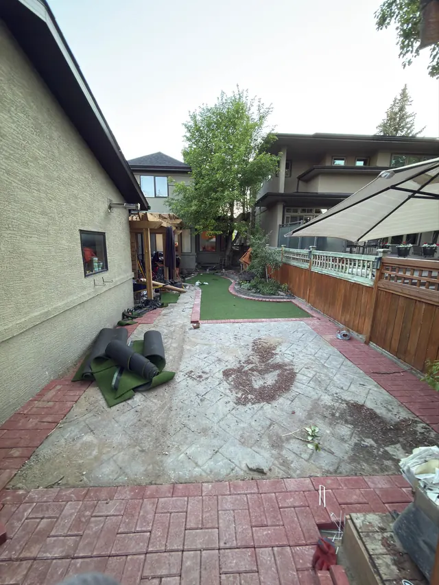 Paver and turf installation in progress
